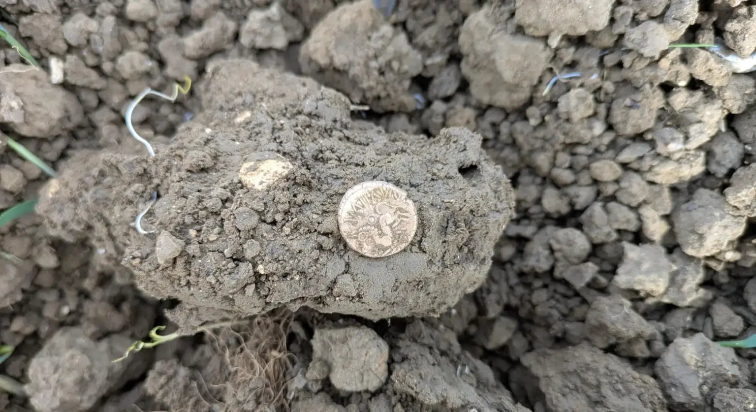 A British metal detectorist uncovered a rare Iron Age gold coin hoard in a Suffolk field, with the remarkable treasure later selling at auction for an impressive £33,200.